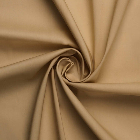 Close-up of beige fabric with folds