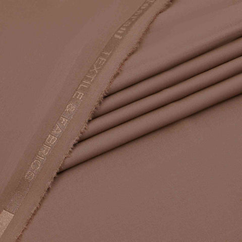 Close-up of a folded brown fabric with 'Exile & Exiles' branding.