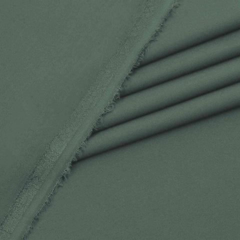 Close-up of green fabric with a textured surface