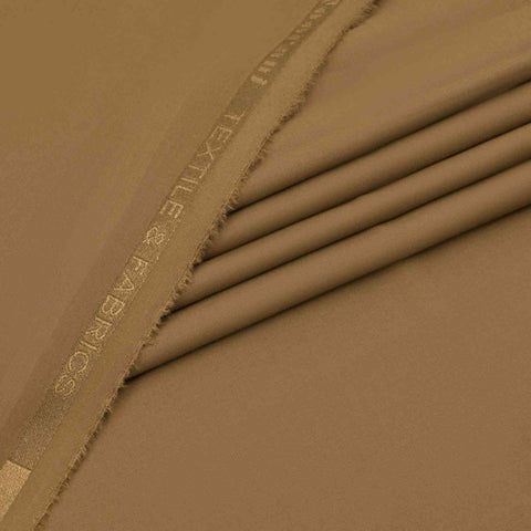 Close-up of brown fabric with 'EXTREME COLD WEATHER' branding.