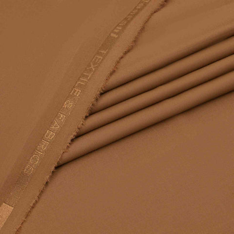 Close-up of brown fabric with 'Exile & Exiles' branding.