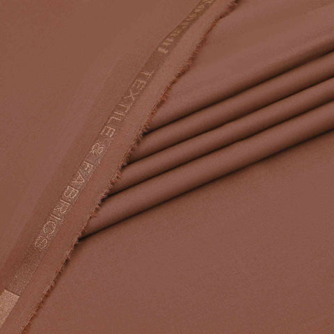 Close-up of brown fabric with 'Exile Separates' branding.